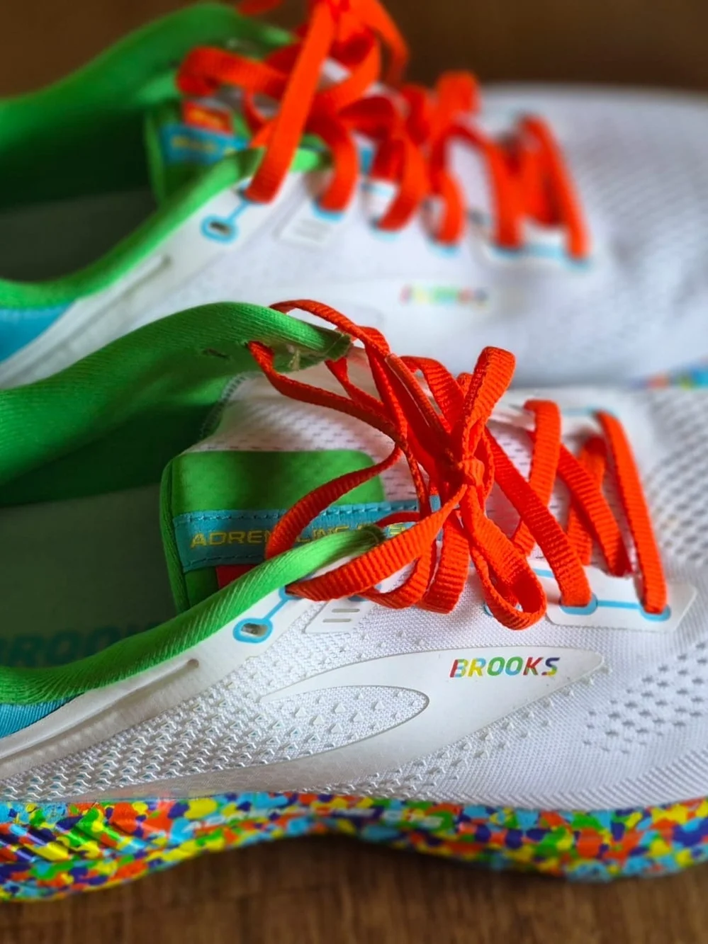 Brooks Kids White Sneakers with Orange Laces and Green Interior